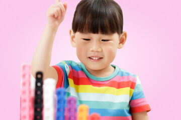 A child plays with educational toys and learns new things